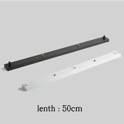 Black and white wall-mounted coat racks with evenly spaced hooks complement decorbites ceiling mount pendant light canopy