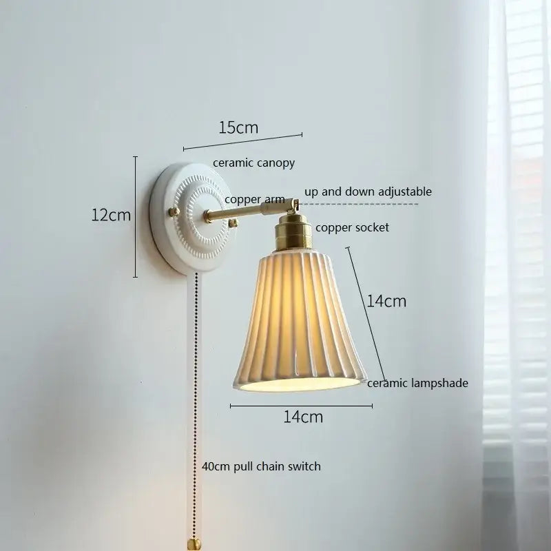 White butterfly ceramic led wall lamp with white ceramic canopy, brass copper arm, and beige fluted ceramic shade