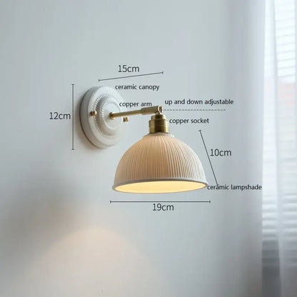 Cream-colored butterfly ceramic led wall lamp with ribbed ceramic led wall shade and brass copper arm for bedroom sconce