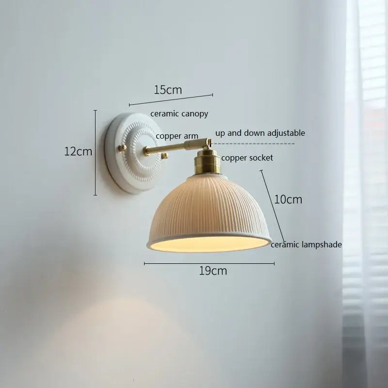 Cream-colored butterfly ceramic led wall lamp with ribbed ceramic led wall shade and brass copper arm for bedroom sconce