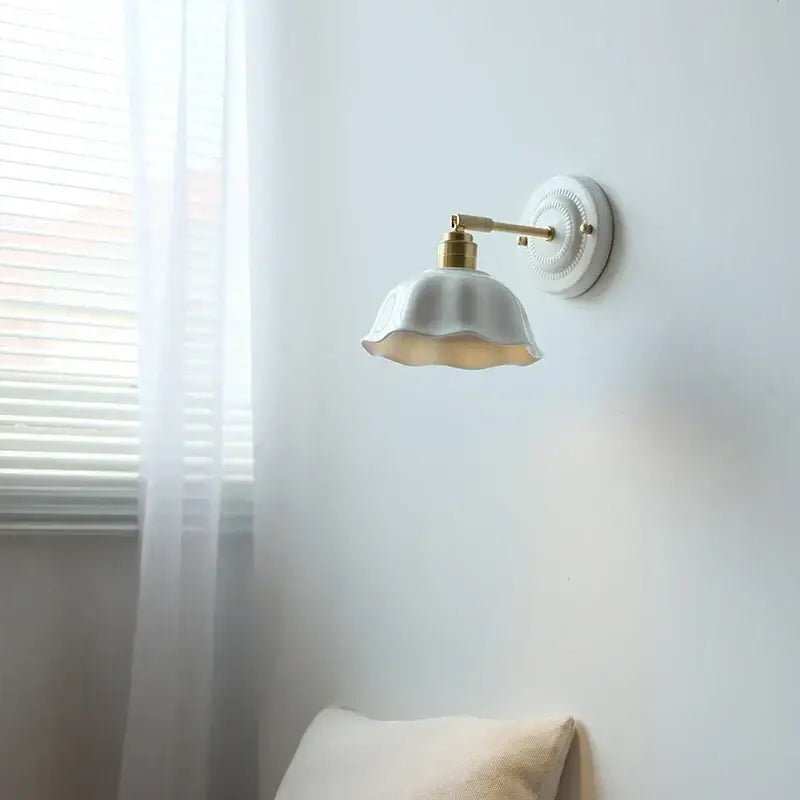 White butterfly ceramic led wall lamp with scalloped edges and gold-toned metal arm for bedroom decor