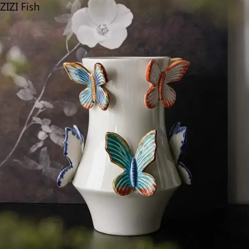 White butterfly ceramic vase by decorbites featuring colorful hand-painted blue teal and orange butterfly decor for living room