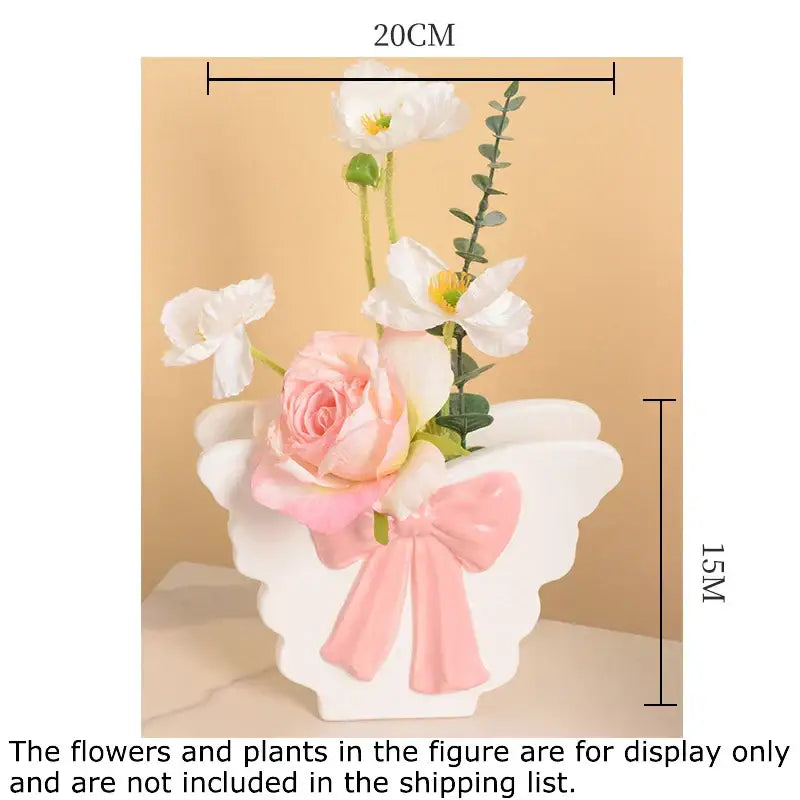 White butterfly ceramic vase with pink bow accent in angel wing shape for living room decor from decorbites butterfly ceramic collection