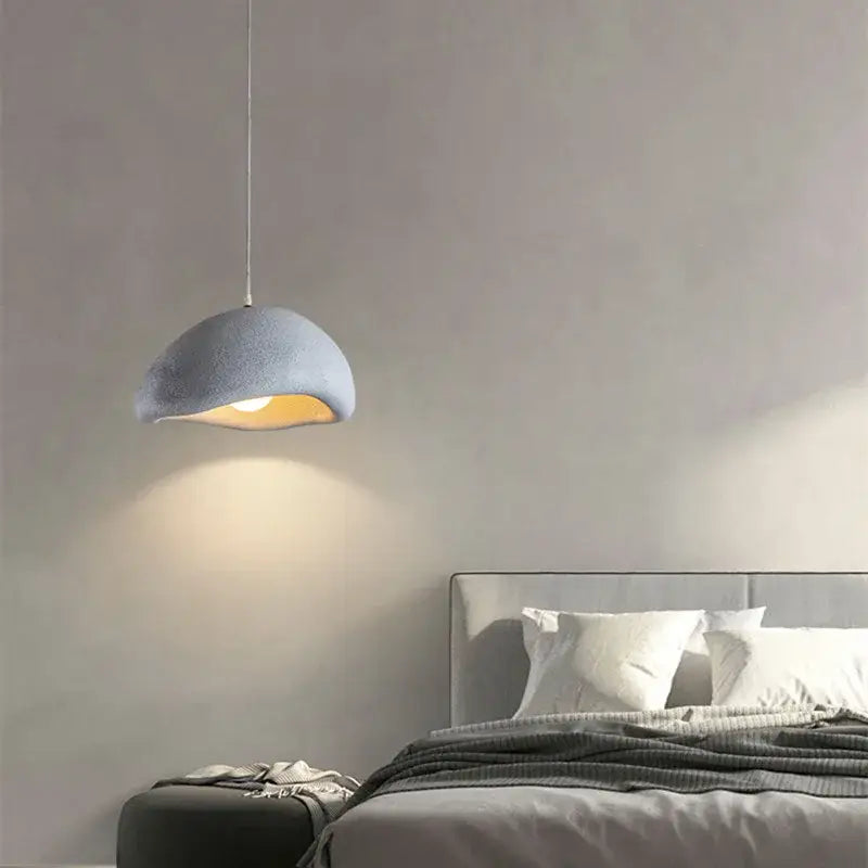 Soft gray dome-shaped pendant light with textured surface and warm glow decorbites cement wind cloud for living room decor