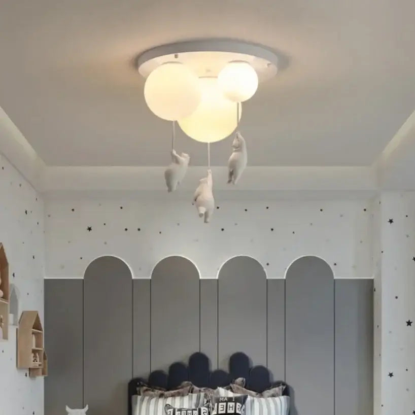 White ceramic bear pendant light with three spherical bulbs designed as a pendant light for bedroom ceilings