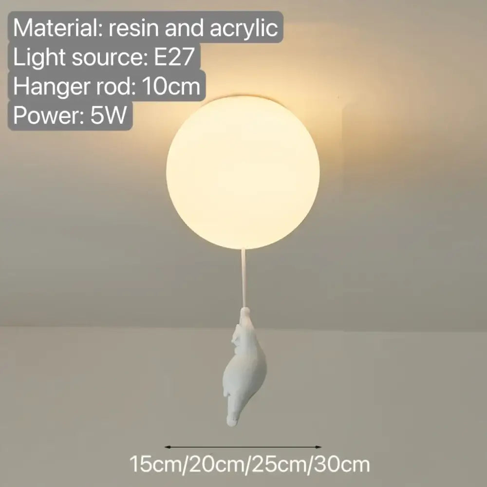 White resin and acrylic spherical pendant light with a dangling bear pendant for bedroom ceiling illumination