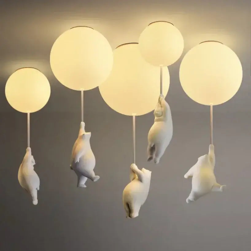 White ceramic balloon bear pendant light with warm-toned glass globes for bedroom ceiling lighting