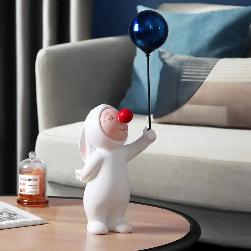 White ceramic balloon rabbit resin figurine holding a shiny blue balloon ideal for bedroom desk decor