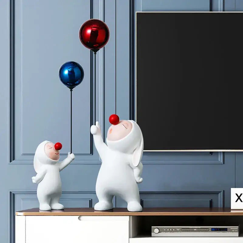 White ceramic balloon rabbit resin ornaments featuring clown figurines with red noses holding colorful metallic balloons