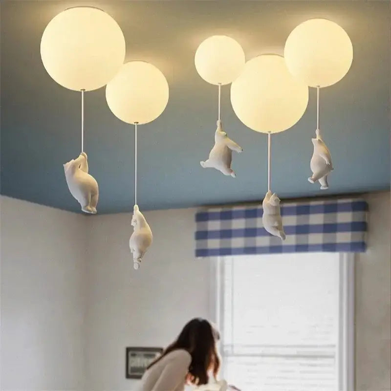 White ceramic bear cartoon pendant lamp with softly glowing spherical orbs for kids bedroom lighting