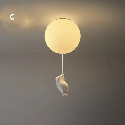White ceramic bear led ceiling chandelier with a frosted glass globe light suspended by a thin cord for bedroom use