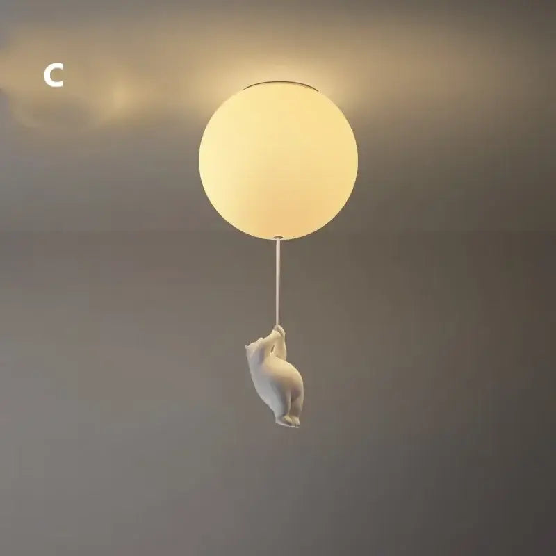 White ceramic bear led ceiling chandelier with a frosted glass globe light suspended by a thin cord for bedroom use