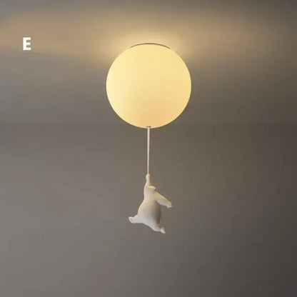 White ceramic bear led ceiling chandelier shaped like a bear holding a balloon with a glass globe light fixture