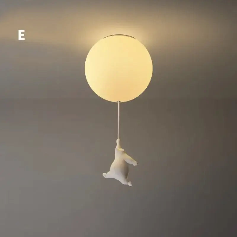 White ceramic bear led ceiling chandelier shaped like a bear holding a balloon with a glass globe light fixture