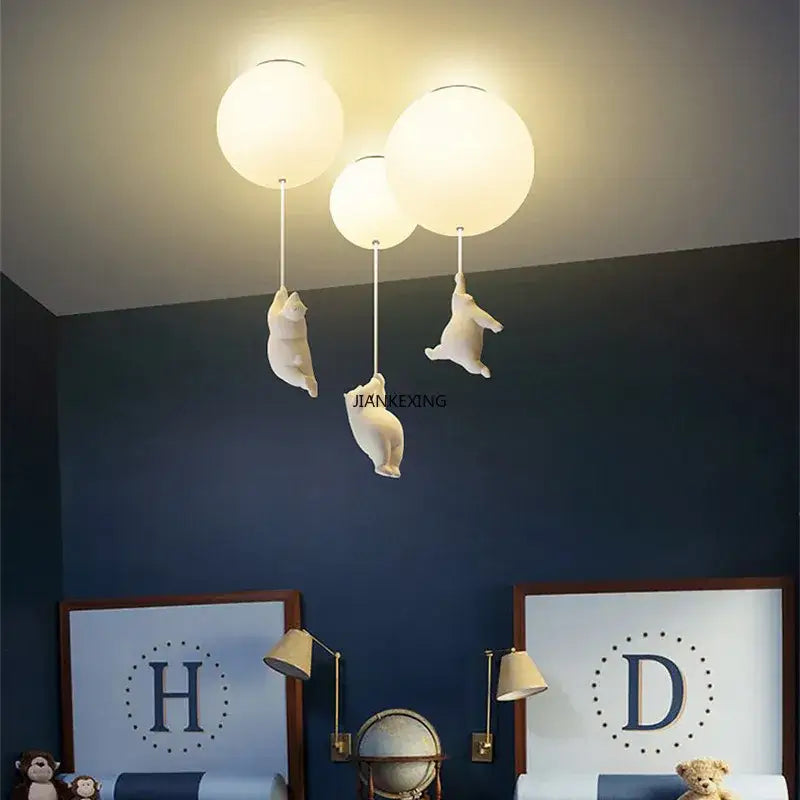 White ceramic bear led ceiling chandelier with three glass globe lights and dangling cat figurines for bedroom lighting