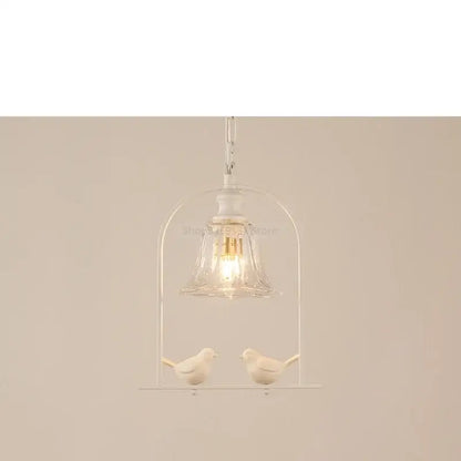 White ceramic bird led pendant light with clear glass bell shade and metallic chain for dining room decorbites bird led decor