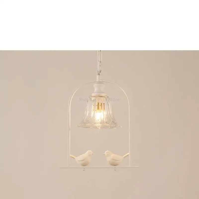 White ceramic bird led pendant light with clear glass bell shade and metallic chain for dining room decorbites bird led decor