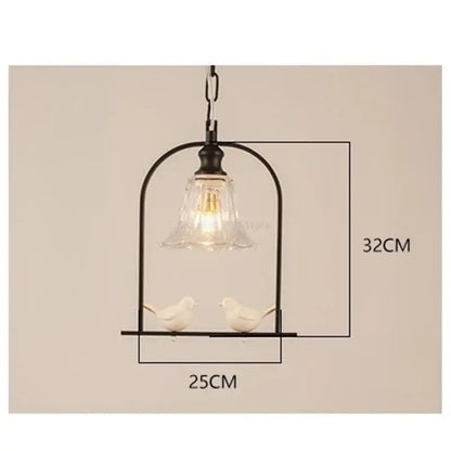 Black metal bird led pendant light with clear glass shade and two white ceramic birds for dining room decorbites bird led