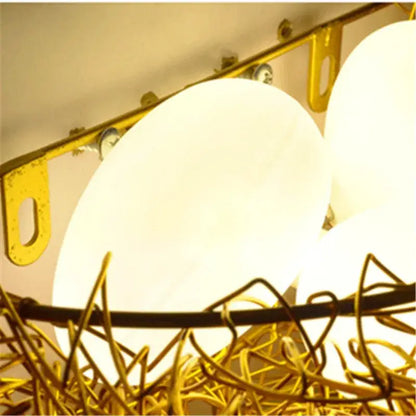Gold-toned wire bird nest led wall lamp with frosted white glass shades for decorbites bird nest bedroom decor