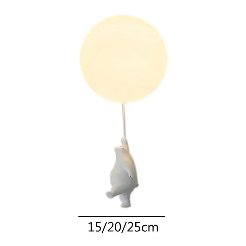 White ceramic cartoon bear ceiling light holding a glowing round balloon lamp for kids bedroom decorbites cartoon bear