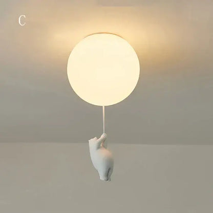 White ceramic ceiling light featuring a softly glowing orb held by a cartoon bear for kids bedroom decorbites cartoon bear