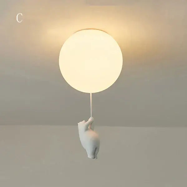 White ceramic ceiling light featuring a softly glowing orb held by a cartoon bear for kids bedroom decorbites cartoon bear