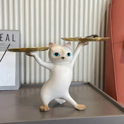 White ceramic cat tray sculpture with blue eyes balancing two gold trays for office desk storage accessory