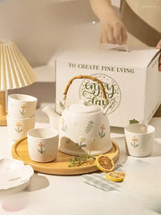 White ceramic daisy teapot set with bamboo handle and delicate floral decals for kitchen tea use