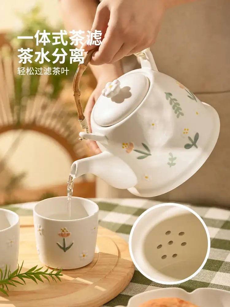 White ceramic daisy teapot set with floral decals bamboo handle and integrated filter for easy tea leaf separation