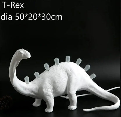 White ceramic dino led desk lamp with textured surface and glowing translucent spikes for bedroom decorbites dino led lighting