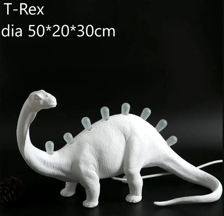 White ceramic dino led desk lamp with textured surface and glowing translucent spikes for bedroom decorbites dino led lighting