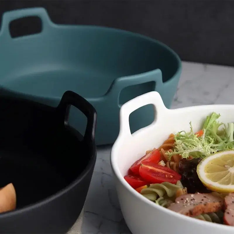 White ceramic double handle salad bowl filled with colorful pasta and fresh vegetables by decorbites ceramic double