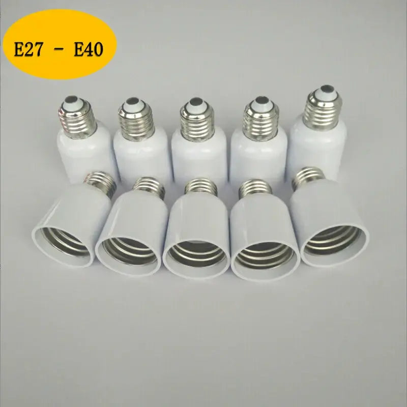White ceramic e27 to e40 light bulb adapter sockets with metallic threaded bases for garage utility use