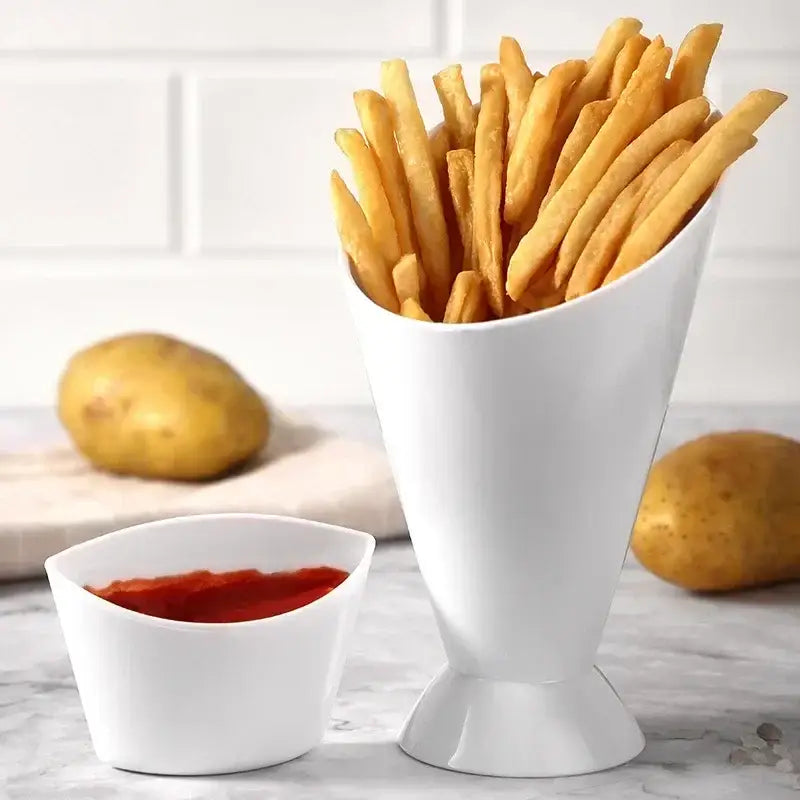 White ceramic french fries holder with cone shape filled with golden-brown fries and integrated sauce cup