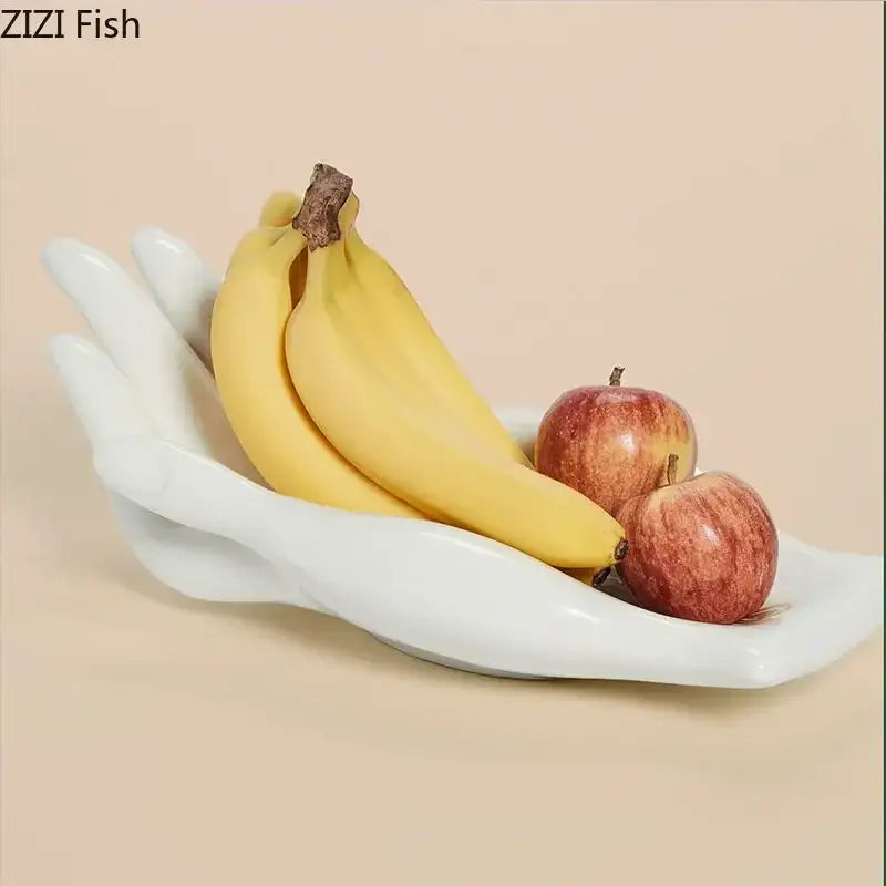 White ceramic hand-shaped fruit plate tray designed as a decorative living room fruit plate tray