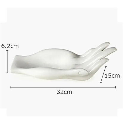 White ceramic hand fruit plate tray featuring a smooth glossy finish and sculpted palm and fingers for living room decor