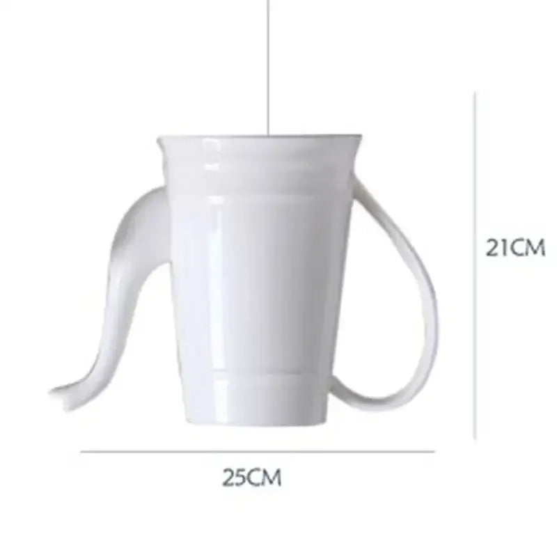 White ceramic cup with two handles alongside ceramic led pendant lights for warm kitchen decorbites ambiance