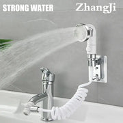 White and chrome handheld shower nozzle with flexible coiled hose mounted on wall for versatile bathroom use