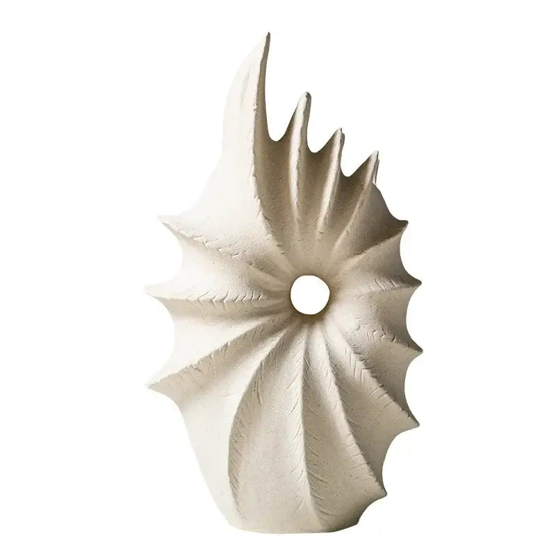 White conch shape ceramic vase with a central hole and leaf-like segments for artificial flower arrangements
