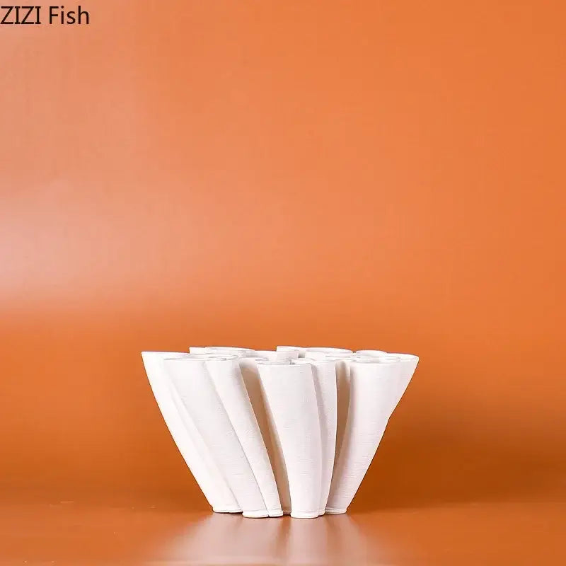 White ceramic vase plant with modern sculptural fluted cone-shaped design for living room floral decor