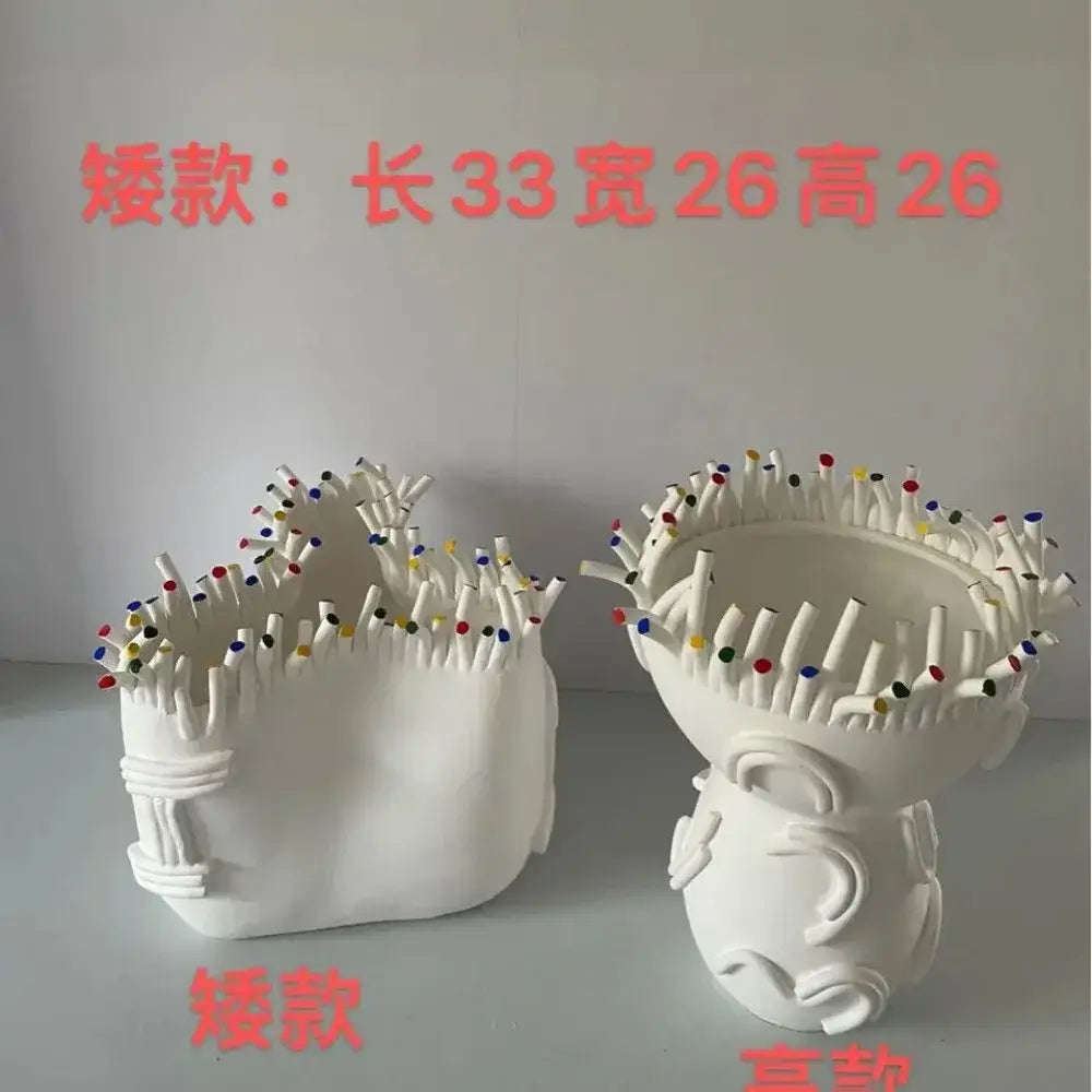 White ceramic flower pot vase with colorful tips and coral shapes designed as matchstick holders for living room decor