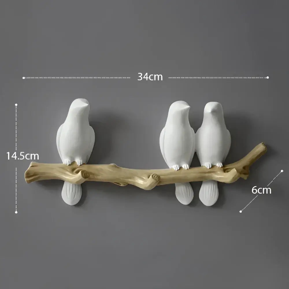 White decorbites bird resin hanger kitchen hook featuring a white ceramic bird on a natural wood branch base