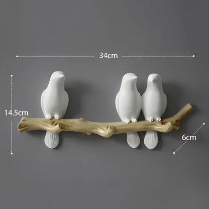 White decorbites bird resin hanger kitchen hook featuring a white ceramic bird on a natural wood branch base