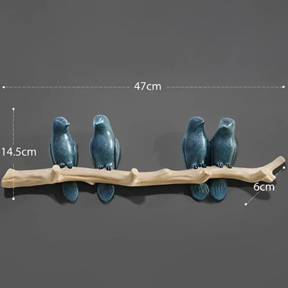 Blue ceramic decorbites bird resin hanger with multiple hooks on a light wood branch for kitchen or wall decor