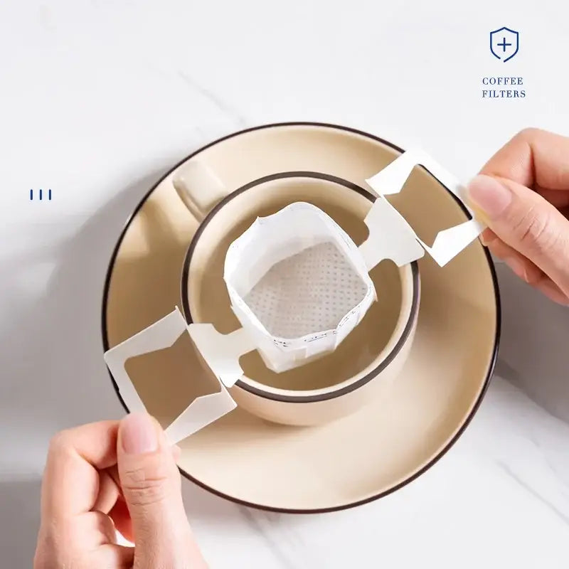 White disposable paper filter bags with perforated design and foldable handles for kitchen pour over coffee filter bags decorbites