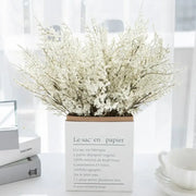 White paper box vase filled with delicate white dried baby’s breath lavender bouquet for living room decor