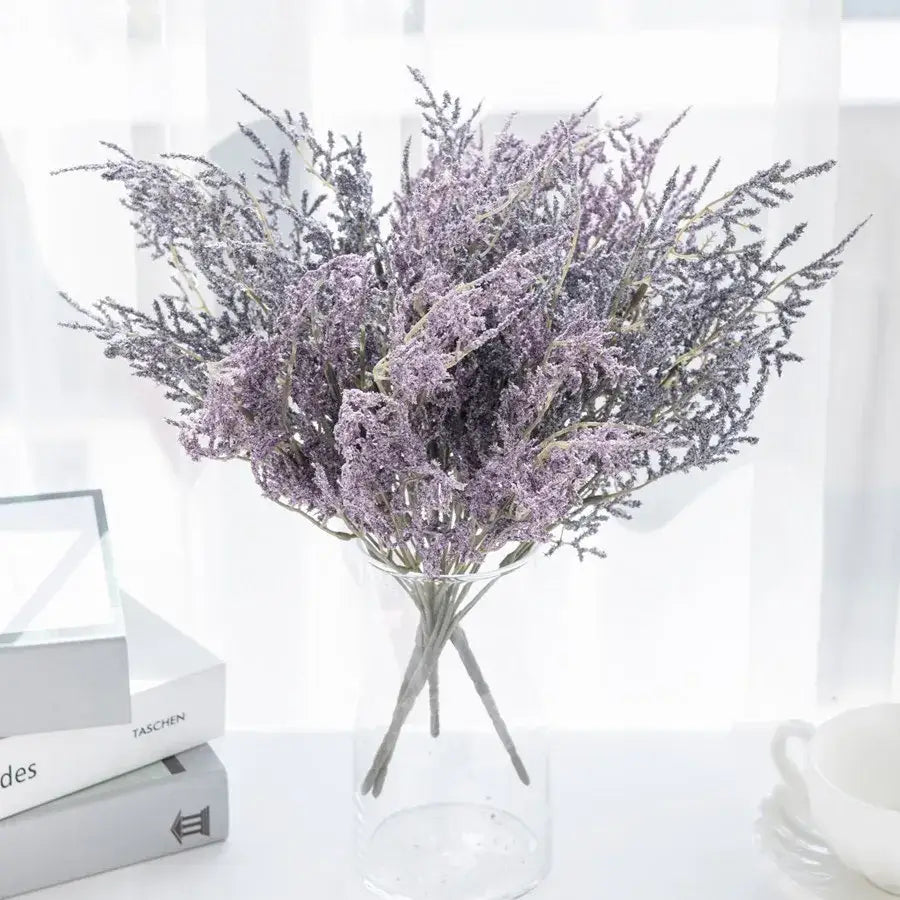A delicate white dried baby’s breath lavender bouquet displayed in a clear glass paper box vase for living room decor