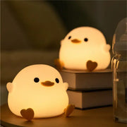 White duck silicone night light glowing with touch sensor timer feature ideal for decorbites duck silicone bedroom use