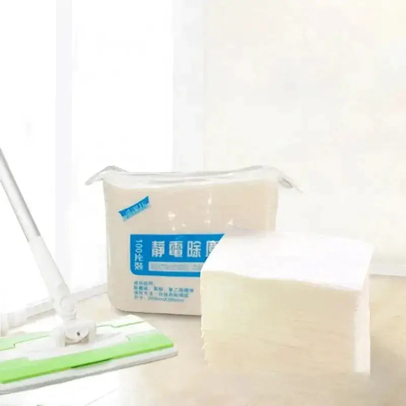 A stack of white rectangular microfiber electrostatic dust removal cloths in clear plastic packaging with blue label