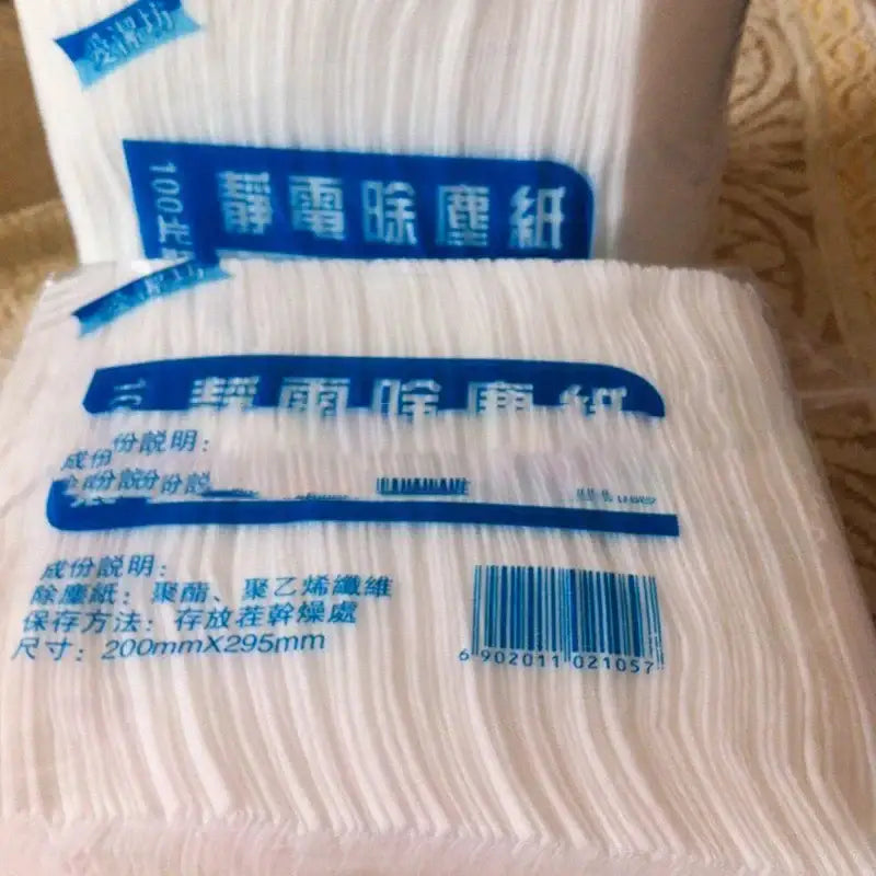 White electrostatic dust removal cloth 100pcs pack with textured material in blue-labeled packaging for kitchen cleaning